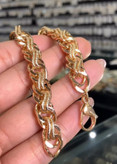 دستبند ژوپینگ اورجینال مدل جی تاش، طراحی زنجیری با حلقههای درهمتنیده و بافت برجسته طلایی