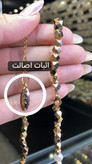 نمای نزدیک قفل گردنبند ژوپینگ و حک لیزری نشان اصالت روی قفل