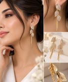 گوشواره ژوپینگ اورجینال مدل بنجامین با سه برگ نگینکاریشده و زنجیرهای آویز بلند، نمای نزدیک روی گوش و چیدمان جفتی محصول