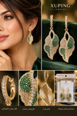 تصویر ژورنالی گوشواره آویز ژوپینگ اورجینال با طراحی برگ توت، نگینهای سبز و سفید و شفاف، آبکاری طلایی و قفل چفتی